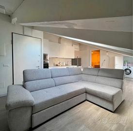 Divano letto angolare con pouf