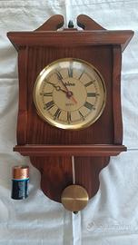 Orologio pendolo in legno con pila
