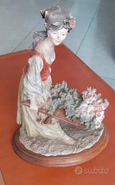 Statua Giuseppe Armani ragazza con carrettino