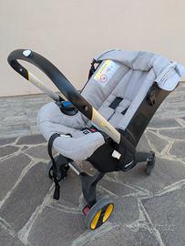 Doona |seggiolino auto e passeggino + base isofix