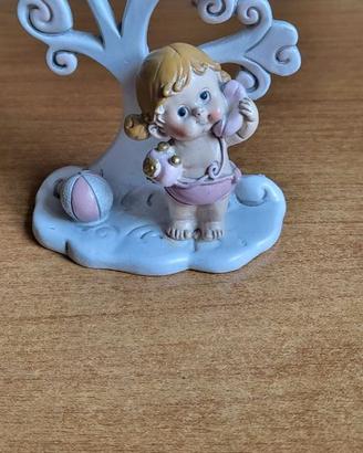 Albero della vita rosa con bimba