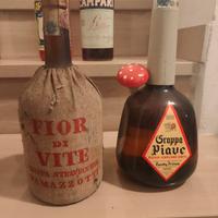 Bottiglie vintage, acqua vite e grappa piave