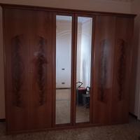 Armadio 6 ante in radica di noce con specchi