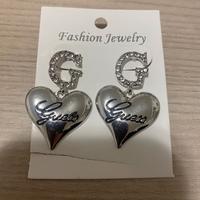 orecchini imitazione guess in acciaio