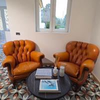 Poltrone Chesterfield in pelle Capitonnè arancione