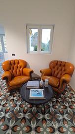 Poltrone Chesterfield in pelle Capitonnè arancione