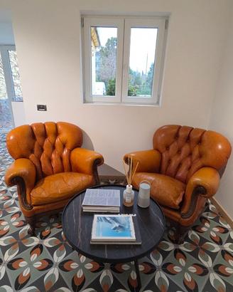 Poltrone Chesterfield in pelle Capitonnè arancione