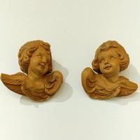 Sculture in legno raffigurante una testa d'angelo