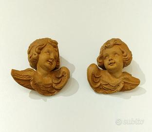 Sculture in legno raffigurante una testa d'angelo