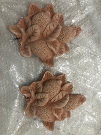 Decorazioni su parete in terracotta