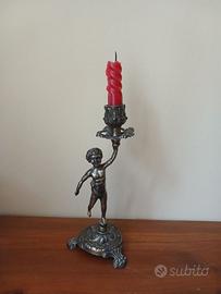 Candelabro antico in ottone con putto