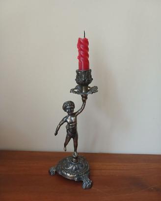 Candelabro antico in ottone con putto