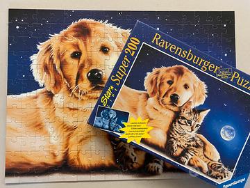 Puzzle Ravensburger luminescente cane e gatto