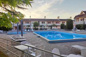 APPARTAMENTO CON GIARDINO PRIVATO E GARAGE