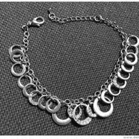 Braccialetto in metallo con anelli e pietre