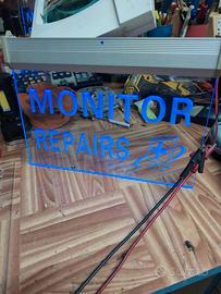 insegna luminosa "Monitor Repair"