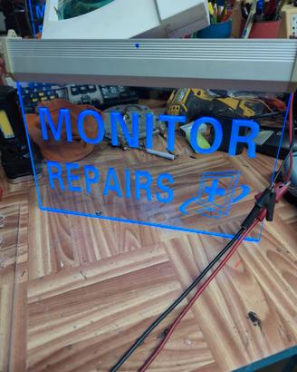 insegna luminosa "Monitor Repair"