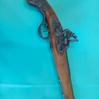 Pistola finta legno e pietra