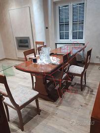 sala da pranzo con tavolo e 6 sedie