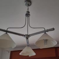 Lampadario moderno in acciaio e vetro