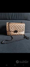 Borsetta borchie rockstud metallizzata