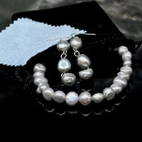 Parure di gioielli bracciale e orecchini di perle