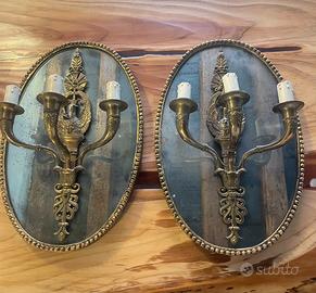 Coppia di applique con candelabro in ottone