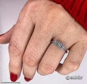 ANELLO TRILOGY IN ORO 18kt. CON DIAMANTI PRINCESS