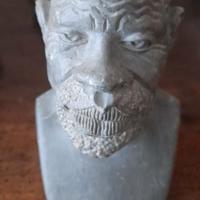 Scultura su pietra, intenso volto di Africano