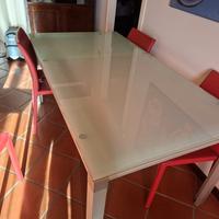 tavolo di vetro allung.6/8 posti +4 sedie in pelle