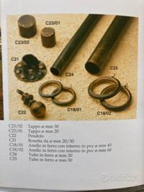 Elementi per tendaggi in ferro battuto