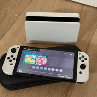 Nintendo Switch Oled + accessori + 2 giochi