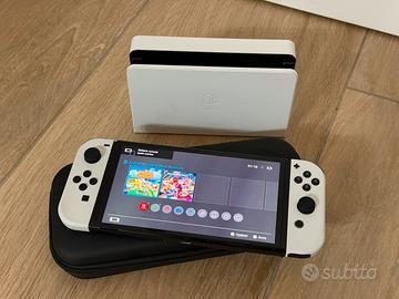 Nintendo Switch Oled + accessori + 2 giochi