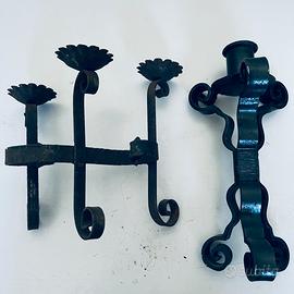 Vecchi candelieri in ferro battuto
