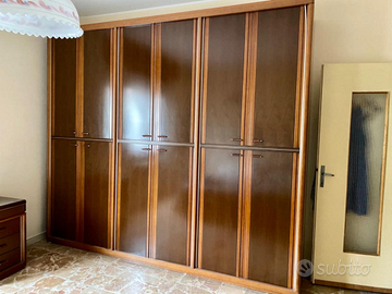 Camera da letto in legno massello