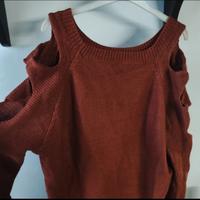 Maglione con maniche aperte. 