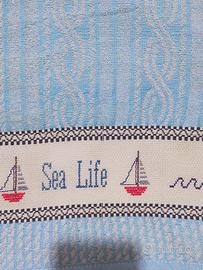 asciugamano ricamato a mano 