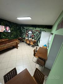 Pizzeria da asporto con posti a sedere