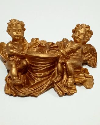 acquasantiera da parete barocca con puttini