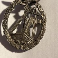 Spilla simbolo marina