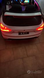 macchina elettrica con telecomando e una MASERATI 