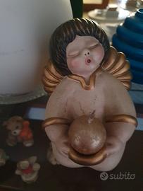 Angelo thun con candela