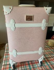 Valigia trolley a mano rosa e bianco con fiori