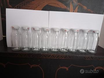 Lotto 9 bottiglie piccole in vetro 