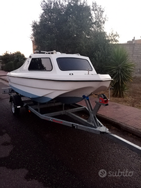 Barca con carrello e motore