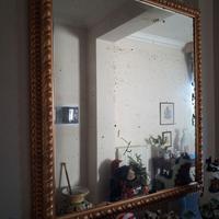 Specchio antico con cornice dorata