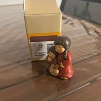 Thun presepe bimbi che magiano pane