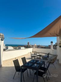 Attico centrale con terrazzo e posto auto