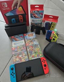 Nintendo Switch OLED, giochi, 4 joy orig., borsa