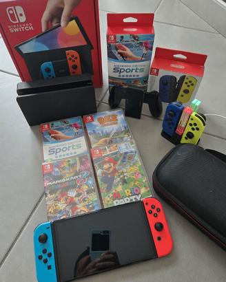 Nintendo Switch OLED, giochi, 4 joy orig., borsa